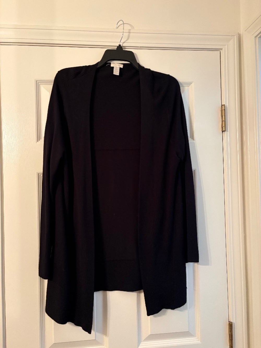 Chico's black cardigan. CHICO'S SIZE 1. No buttons come's just top of the thigh.